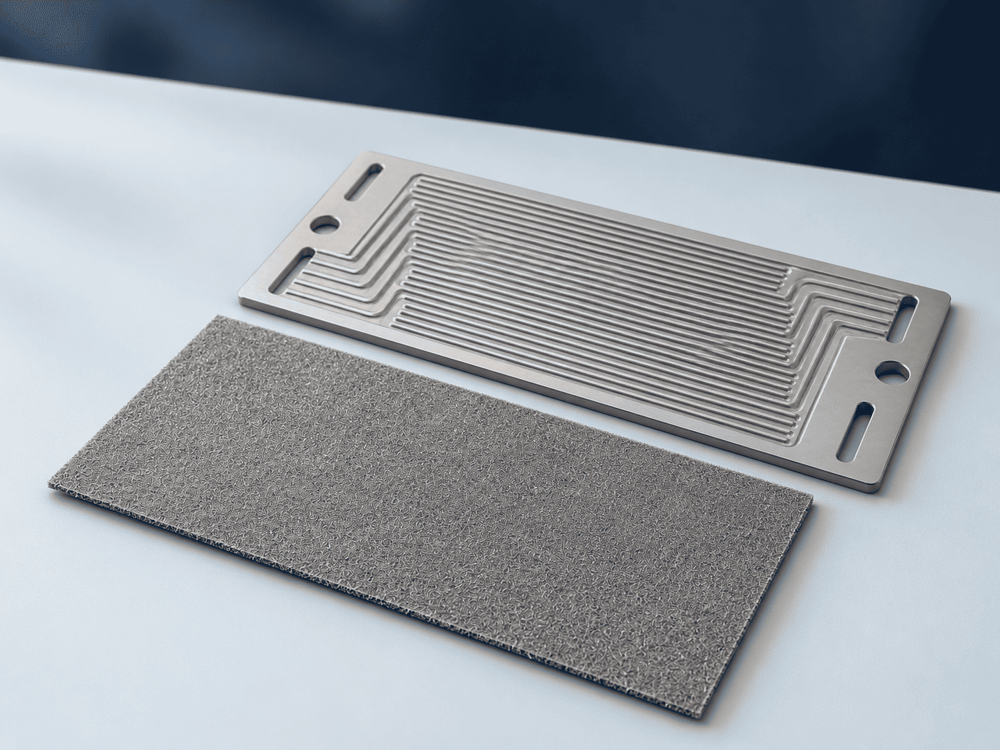 Titanium flow plate and separate thin porous transport sheet for PEM electrolyser interfaces