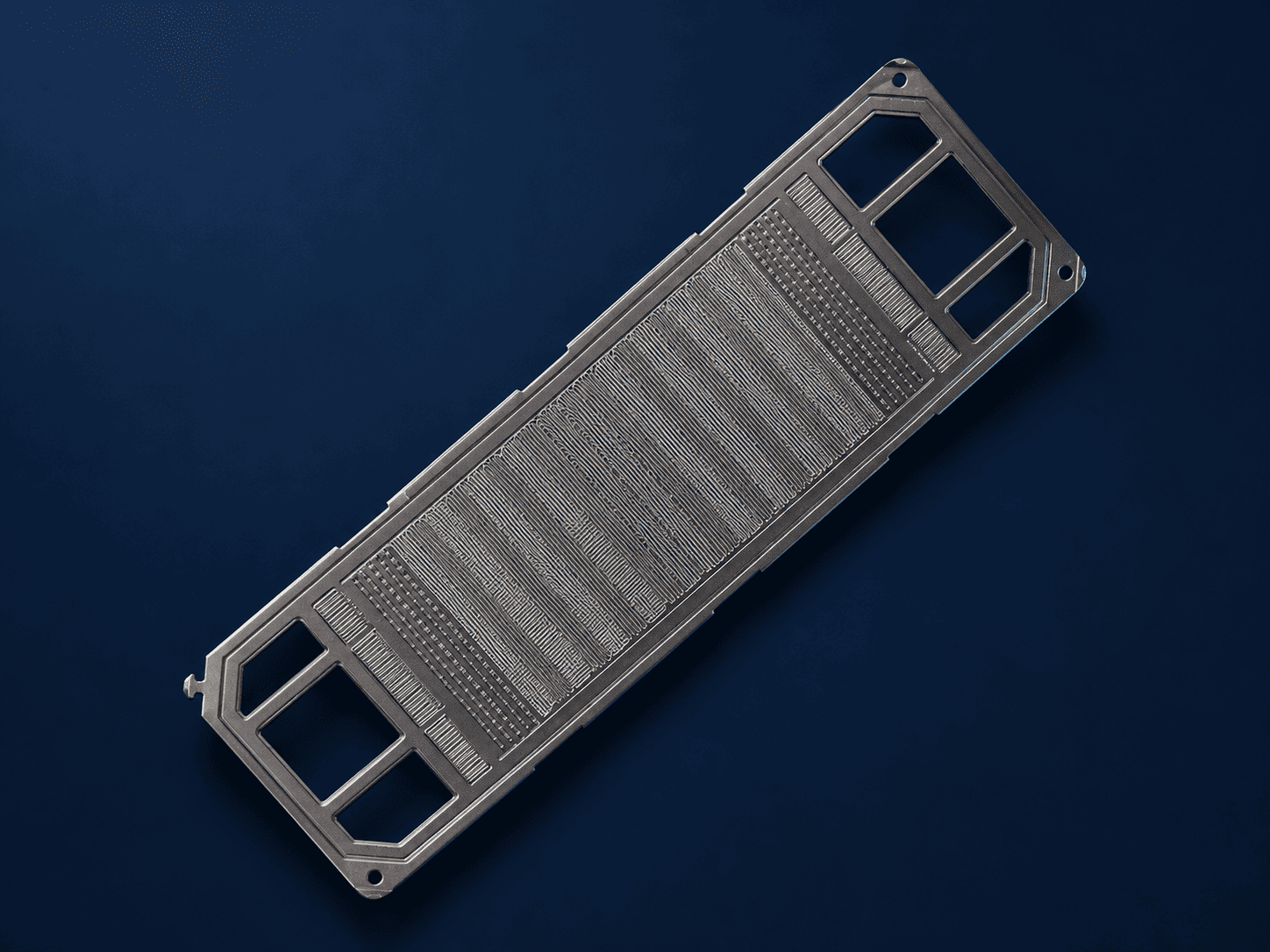Coated metallic bipolar plate with formed flow-field channels